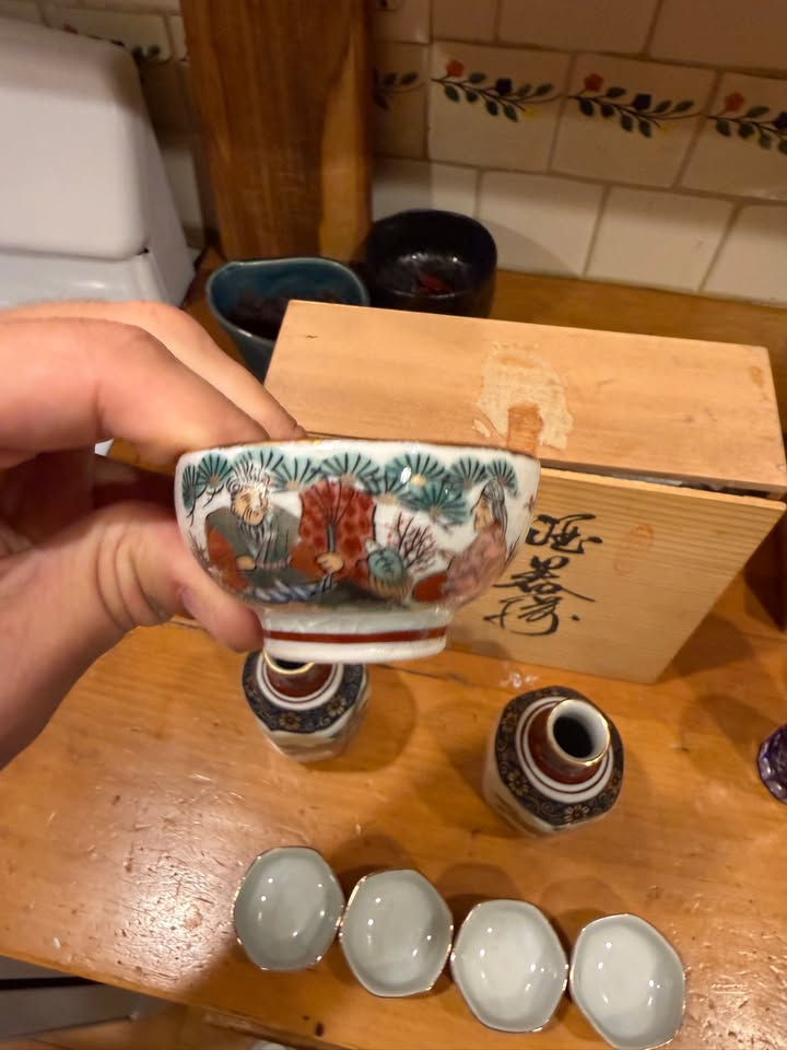 Sake cup with figure decoration
